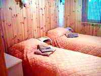 One of bedrooms in Wooden cottages Health resourt Sovinyon Rest in Odessa